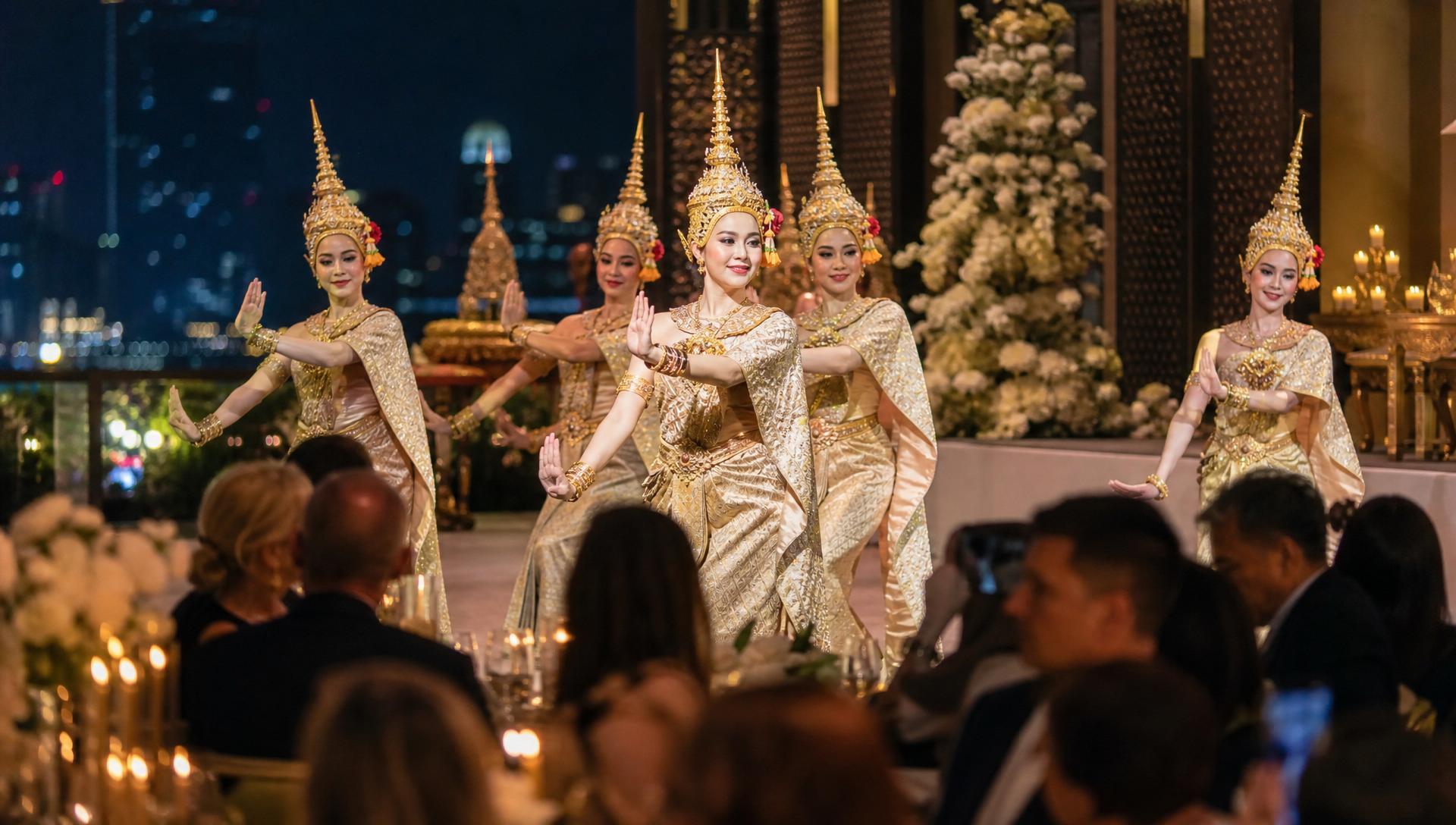 Thai classical dancers in gold traditional costumes performing at a luxury Bangkok event hosted by Luxoria Entertainment